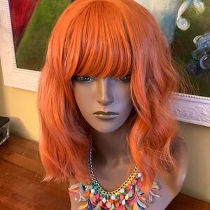 Reddish orange synthetic wig